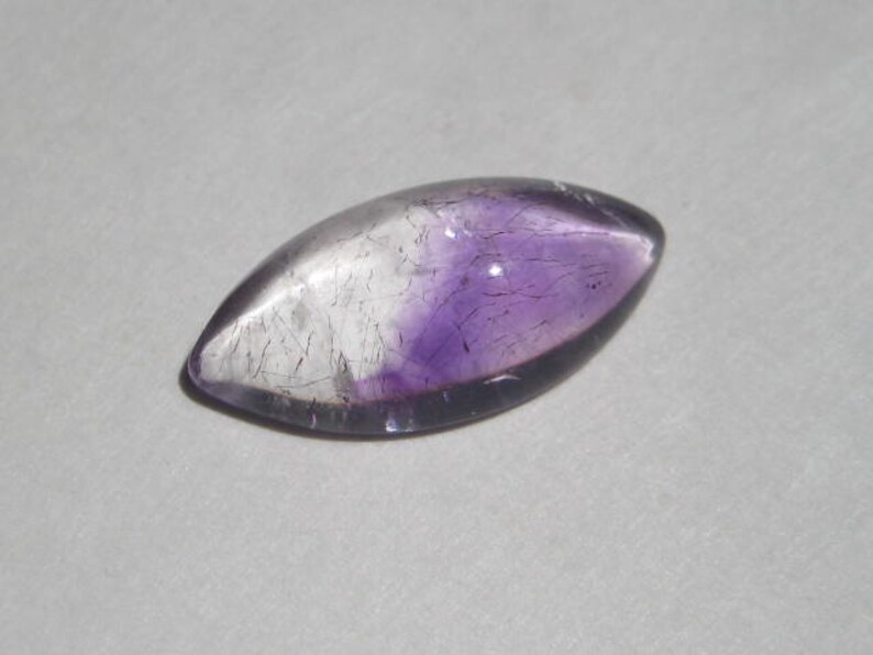 a4380 20 x 10 x 5 mm . Lepidocroiste and Amethyst in Quartz cab .....