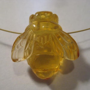 carved Amber  Bee bead  . Real . Natural Amber .        22 x 21 x 12 mm .        B5338