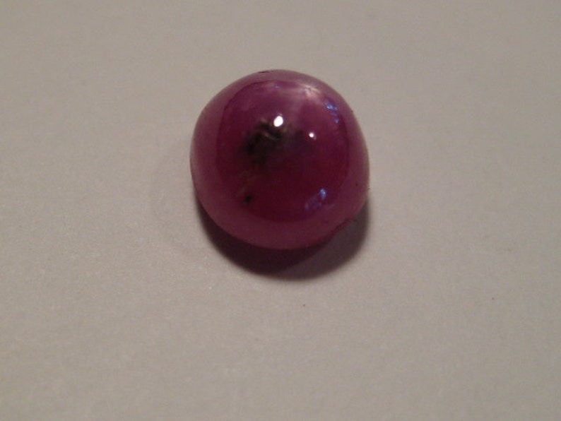 Star Ruby cab ..... 1277 6 mm x 4 mm tall ..