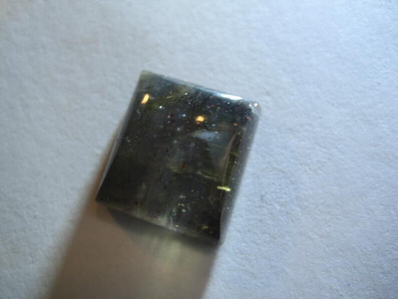 B5140 16 x 15 x 7 mm .. Blue Iolite Sunstone cab ........