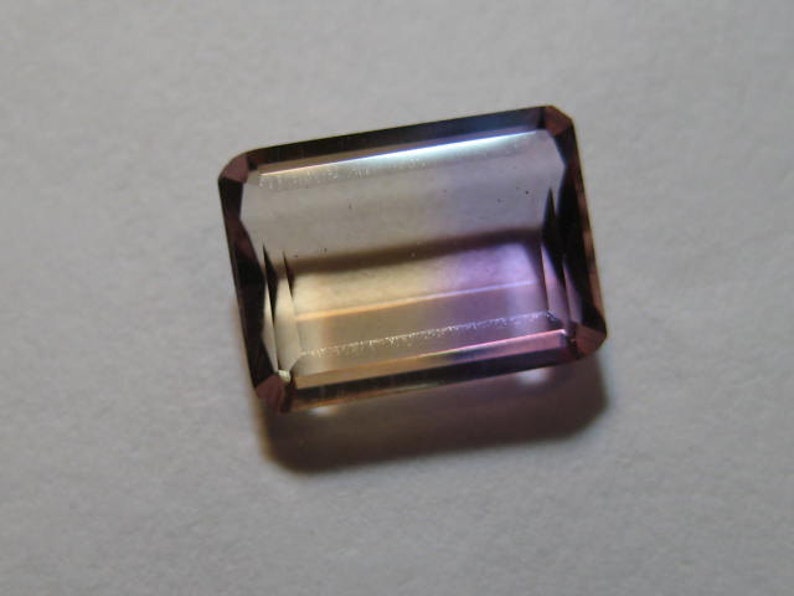 Ametrine faceted gemstone ....................... B698 9.5 x 7 x 3.2 mm .....