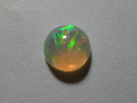 Ethiopian Opal cab... 6 mm de de de diamètre x 3.5 mm... B674 c81161 Ethiopian Opal cab... 6 mm de de de diamètre x 3.5 mm... B674 c81161