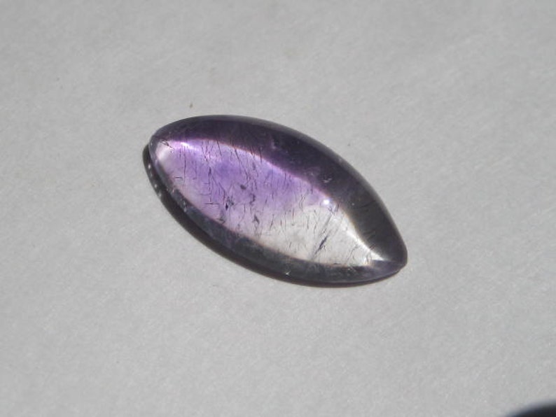 a4380 20 x 10 x 5 mm . Lepidocroiste and Amethyst in Quartz cab .....