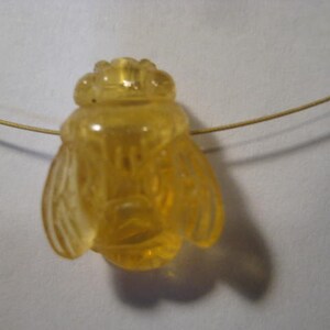 carved Amber  Bee bead  . Real . Natural Amber .        17 x 13 x 8 mm .        B5311