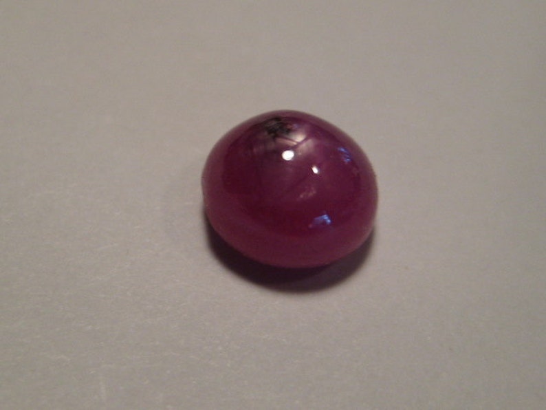 Star Ruby cab ..... 1277 6 mm x 4 mm tall ..
