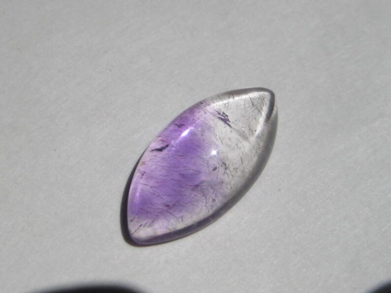 a4380 20 x 10 x 5 mm . Lepidocroiste and Amethyst in Quartz cab .....