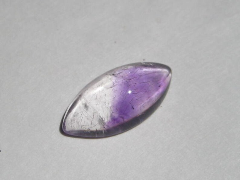 a4380 20 x 10 x 5 mm . Lepidocroiste and Amethyst in Quartz cab .....