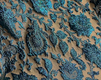 Metallic brocade in a floral pattern with blue metallic threading, blue and bronze colors