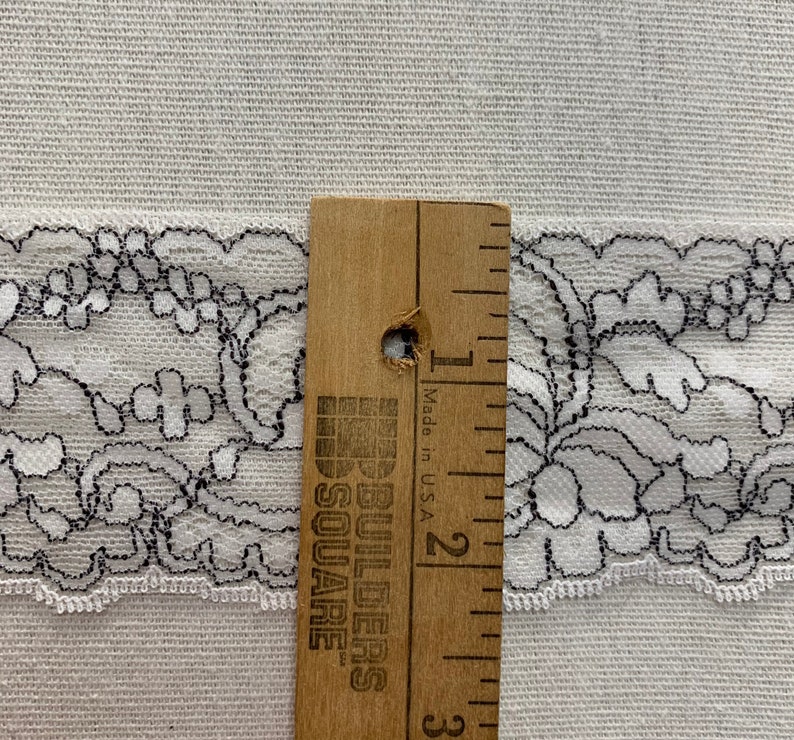 Domestic lace trim 2 14\u201d wide white and black scalloped trim light weight scalloped floral trim sold by the yard