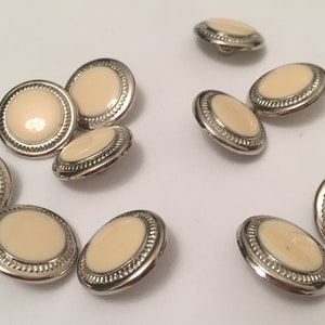 Medium Silver buttons with a beige ivory  like flate center buttons medium button silver edging shank back size are 3/4&quot; 20mm 6 buttons
