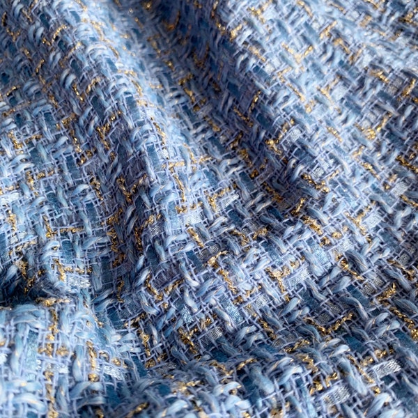 Light blue sparkle tweed fashion fabric with gold metallic thread
