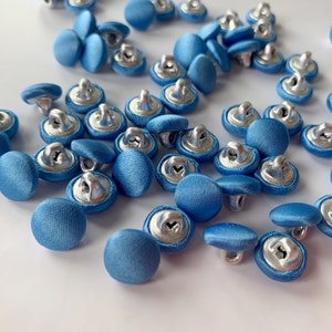 Bridal Buttons satin covered by the Dozen color cornflower blue shank back covered buttons. Cornflower blue blue covered buttons.