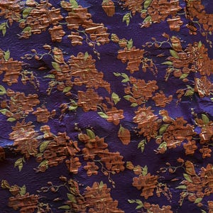 Bronze Floral brocade on purple background with metallic threading