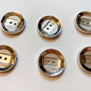 Silver medium button with decorative design button plastic sewing buttons with 2 hole sew through button size are 7/8” 6 to this order