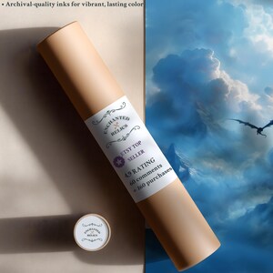 May include: A rolled print in a tan tube with a label that reads "Enchanted Relics, Etsy Top Seller". The print features a fantasy landscape with a dragon. The tube is next to a print with a blue sky and clouds.
