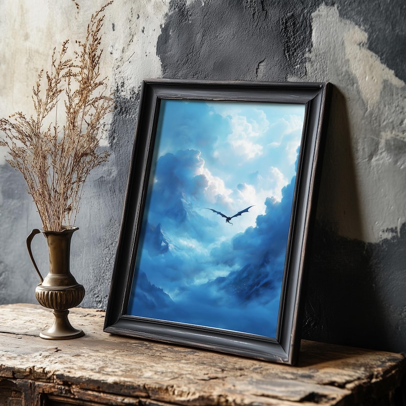 May include: A framed print depicting a dragon flying through a dramatic, blue sky filled with clouds. The artwork is in a black frame, set against a textured wall. A decorative vase with dried plants is on the left.
