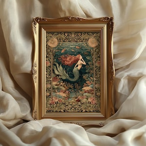 May include: A framed art print featuring a mermaid with flowing red hair and a green tail, swimming in an underwater scene. The artwork is set within an ornate gold frame, showcasing a vintage aesthetic. The print includes coral and fish.