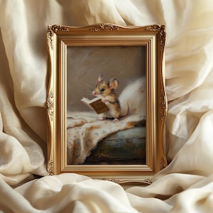 May include: A rectangular gold-toned ornate frame containing a painting of a small brown and white mouse standing on a textured surface while holding an open book. The mouse has large ears and whiskers, and the painting features soft neutral tones.
