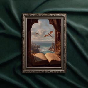 May include: Framed artwork depicting a fantasy scene with dragons soaring over a coastal landscape. The artwork is framed in a silver-colored ornate frame. An open book is in the foreground, with the ocean and sky visible through a window.
