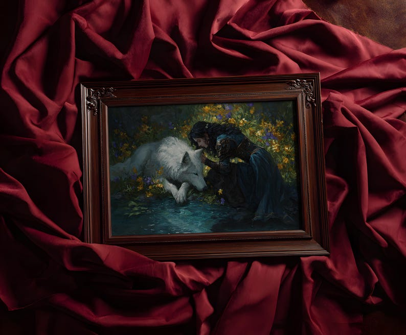 May include: A framed artwork featuring a woman and a white wolf in a forest setting. The woman, in a dark blue dress, is interacting with the wolf near a body of water. The frame is dark brown, and the background is a deep red fabric.