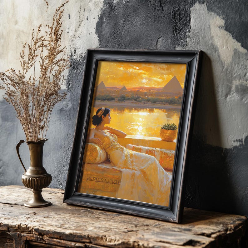 May include: A framed painting of a woman in a white dress sitting on a bench overlooking a body of water with pyramids in the background. The sky is a vibrant orange and yellow.