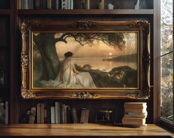 May include: A rectangular landscape painting in an ornate gold frame depicting a person in a flowing white garment sitting under a large tree by a lake at sunset. The scene features calm water, distant hills, and small boats on the horizon.
