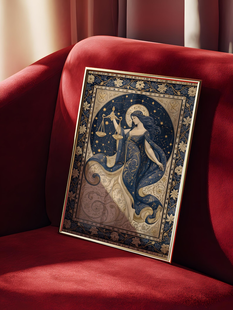 May include: A framed art print featuring a celestial illustration of a woman holding scales, representing Libra. The artwork is set against a dark blue starry background with gold accents, framed in a gold border. The print is displayed on a red velvet surface.