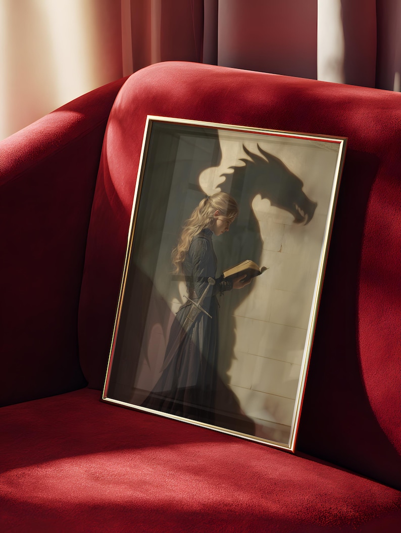 May include: A framed artwork featuring a woman in a dark dress reading a book, with a dragon's shadow cast on the wall behind her. The artwork has a gold frame and is set against a red velvet couch.