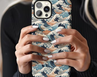 May include: A phone case with a blue and white wave pattern. The case is made for an iPhone with a camera bump.