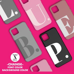 May include: Several phone cases in different colours, each displaying a large letter in a contrasting shade. The cases are arranged on a bright pink background. The text "WORLD X CELL" and "-CHANGE- FONT COLOR BACKGROUND COLOR" are also visible.