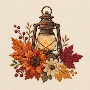 May include: An embroidery design featuring a brown lantern with a glowing yellow flame, surrounded by autumn foliage including orange and red maple leaves, a large orange sunflower, a smaller cream daisy, and sprigs of red and orange berries.
