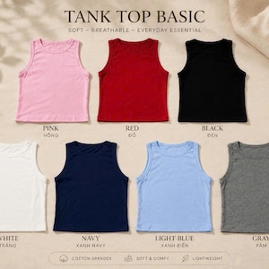 Op de afbeelding: Zeven mouwloze tanktops gerangschikt in twee rijen, met de tekst TANK TOP BASIC. De kleuren zijn roze, rood, zwart, wit, marineblauw, lichtblauw en grijs. Elke top heeft een ronde halslijn en een rechte zoom, gelabeld met kleurnamen in het Engels en Vietnamees.