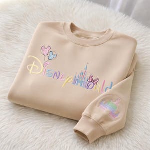 May include: A set of three ceramic mugs with a speckled, matte finish. The mugs are in shades of cream, light gray, and dark gray. Each mug has a simple, minimalist design, perfect for coffee or tea.