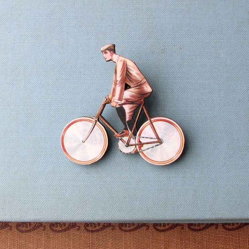 antique french style guy on a bicycle tie tack brooch pin cyclist jewelry