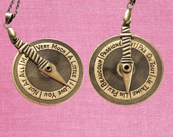 love meter spinner necklace in English and French, double sided on long chain