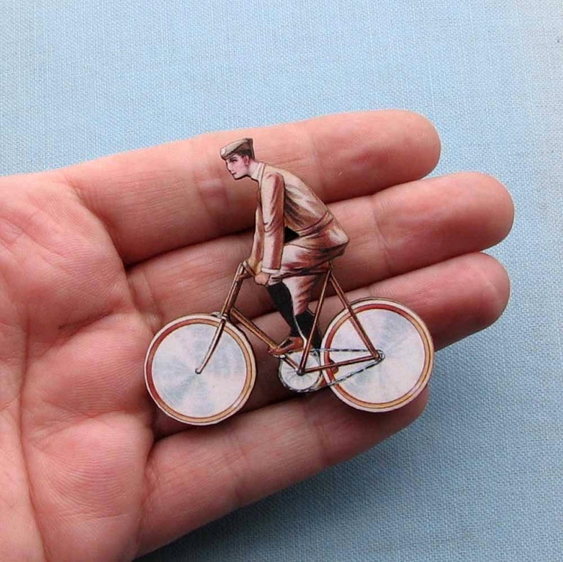 antique french style guy on a bicycle tie tack brooch pin cyclist jewelry