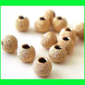 2mm 3mm 4mm 5mm 6mm 7mm 8mm 10mm 12mm 14k yellow gold filled stardust star dust seamless round bead spacer gs20 image 2