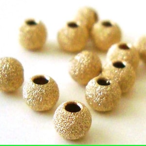 2mm 3mm 4mm 5mm 6mm 7mm 8mm 10mm 12mm 14k yellow gold filled stardust star dust seamless round bead spacer gs20 image 1