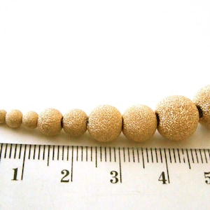 2mm 3mm 4mm 5mm 6mm 7mm 8mm 10mm 12mm 14k yellow gold filled stardust star dust seamless round bead spacer gs20 image 8