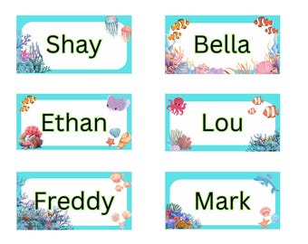 May include: Six personalized name tags with an ocean theme. Each tag has a white rectangular center with a name in black text, surrounded by a light blue border and colorful sea life illustrations, including fish, coral, and jellyfish.
