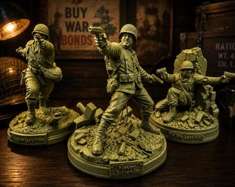 May include: Three olive-drab soldier figurines in combat gear, each mounted on a circular base with text. The left base reads Freedom Isn't Free, the center reads Never Surrender, and the right reads To The Last MAG. Each soldier holds a pistol.