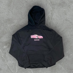 May include: Black hooded sweatshirt with a pink car graphic and the text "S2000" embroidered on the front.