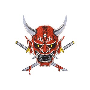 May include: Embroidered patch of a red Oni mask with yellow eyes, white fangs, and two crossed katanas. The mask has two curved horns and a menacing expression. The katanas have yellow hilts and silver blades with red blood stains.