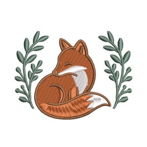 May include: An embroidered design featuring a sleeping fox in shades of orange and white, curled up with its tail tucked in. The fox is surrounded by two green leafy branches, all set against a white background.