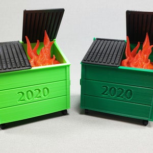 May include: Two green dumpsters with black lids and wheels. The lids are open and there are orange flames inside each dumpster. The dumpsters are labeled "2020".