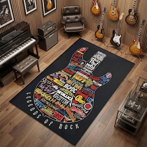May include: Black rectangular rug with a guitar shape design. The guitar is filled with colorful band logos and the words "Legends of Rock" are along the bottom. Guitars and musical equipment are in the background.