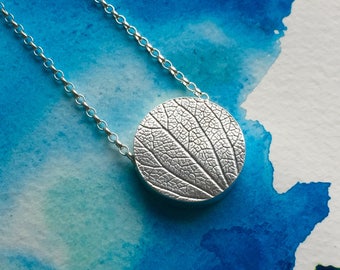 Silver hydrangea disc necklace