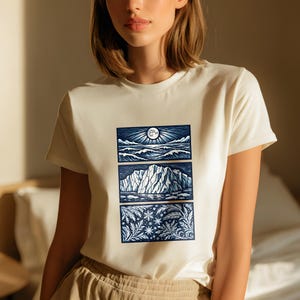 Elemental shirt — three-panel woodcut triptych with arctic waves, iceberg and frost crystals in ice blue and white on navy, nature elements shirt for ocean lovers