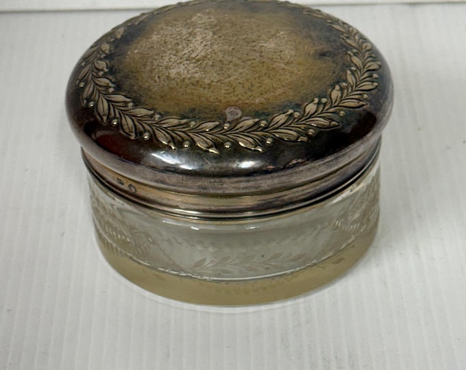 Toiletry container/powder compact