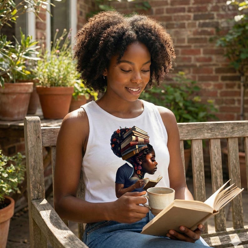 May include: A white tank top featuring a graphic of a woman with books stacked on her head, holding a book and a mug. The woman in the image is sitting on a wooden bench, reading a book.